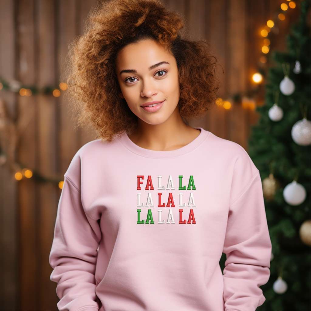 Female wearing a Pink sweatshirt embroidered with Fa la la in Christmas Colors - DSY Lifestyle