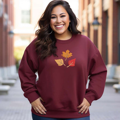 Female wearing a burgundy Sweatshirt embroidered with Fall leaves - DSY Lifestyle 