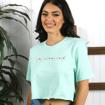 Female wearing a Mint crop top embroidered with the word Feminist in the friends show font - DSY Lifestyle