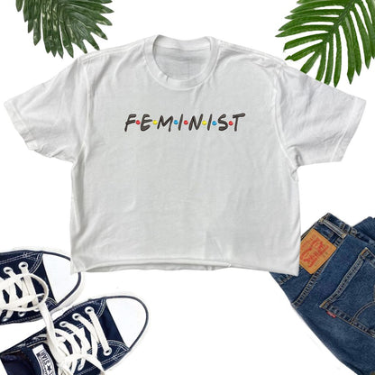 Female wearing a White crop top embroidered with the word Feminist in the friends show font - DSY Lifestyle