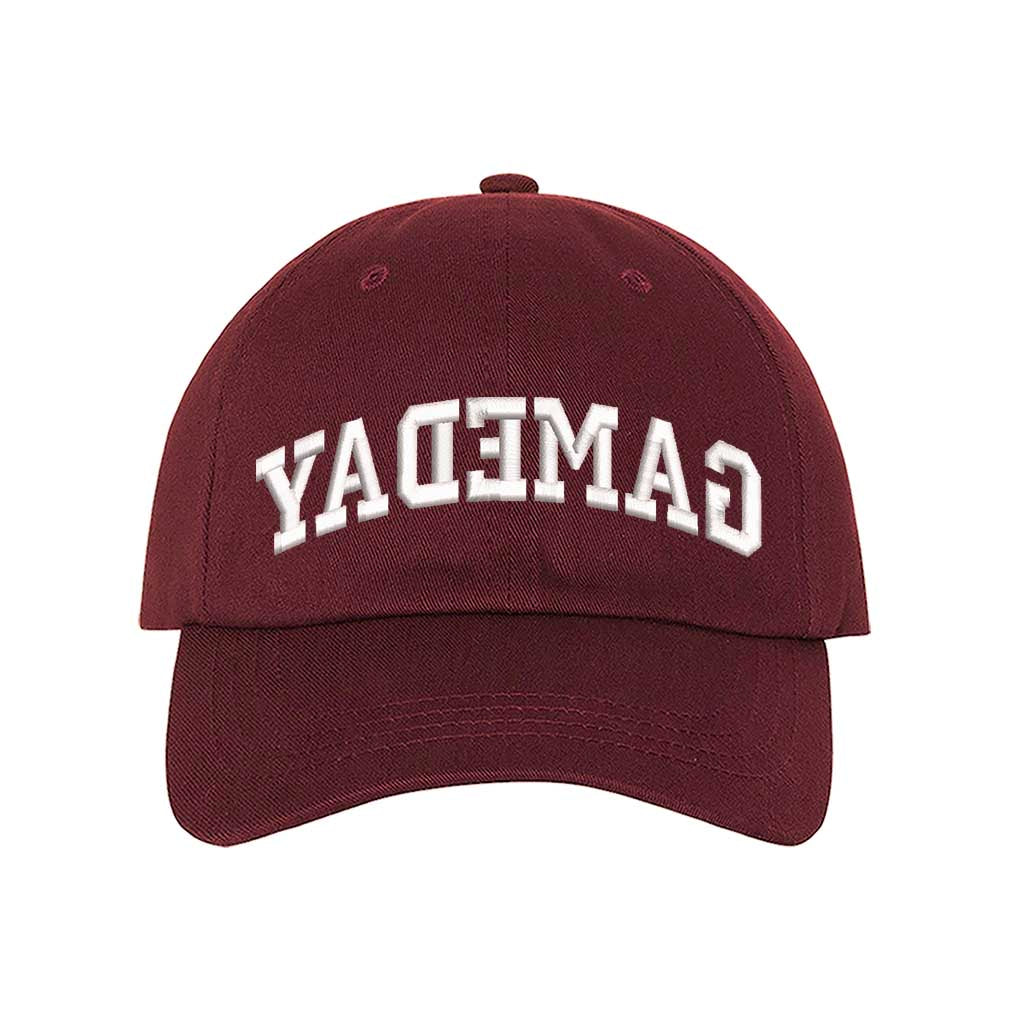 Burgundy baseball hat embroidered with the phrase gameday backwards-DSY Lifestyle