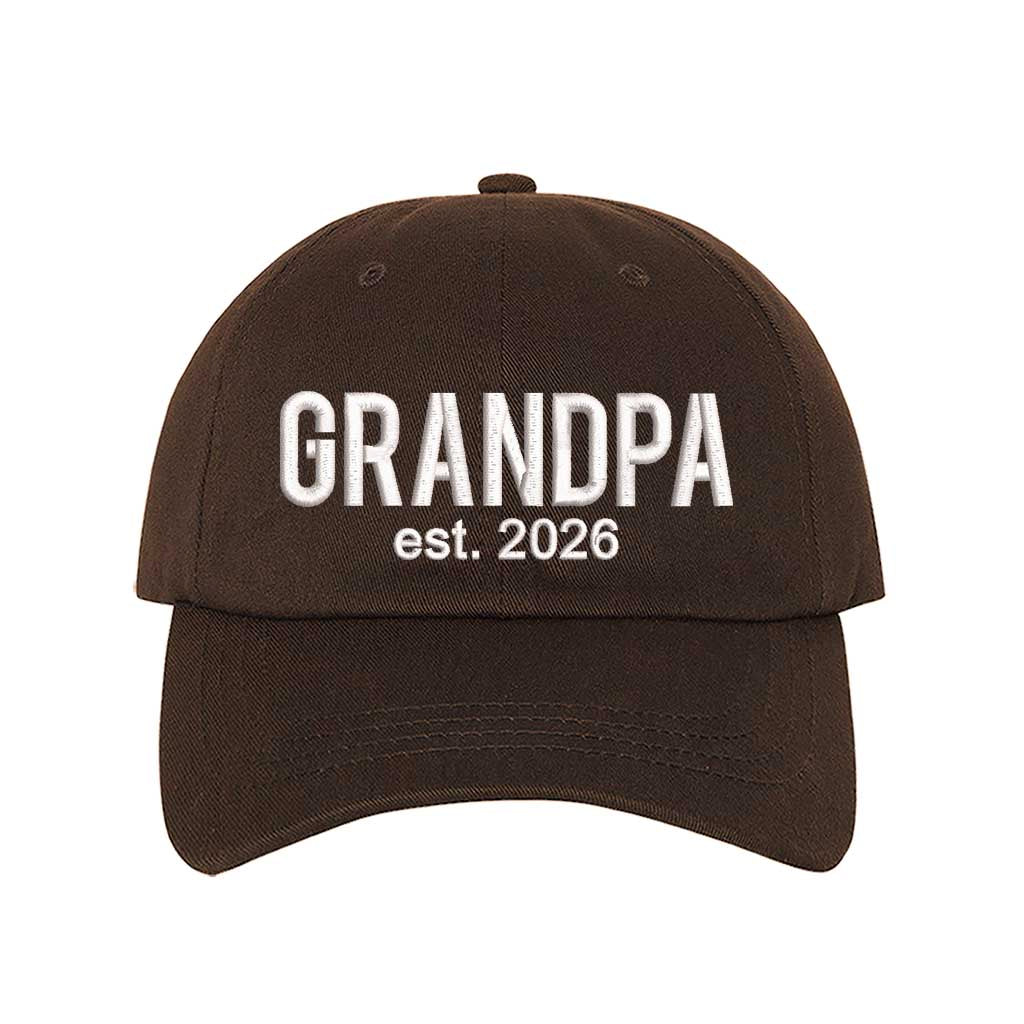 Brown Grandpa Est. 2026 Baseball Hat featuring bold white embroidery on a premium dad cap; a stylish 2026 announcement gift for new grandfathers by DSY Lifestyle.