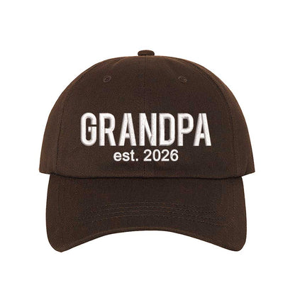 Brown Grandpa Est. 2026 Baseball Hat featuring bold white embroidery on a premium dad cap; a stylish 2026 announcement gift for new grandfathers by DSY Lifestyle.