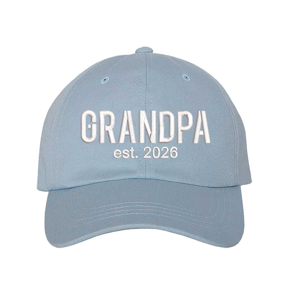 Sky Blue Grandpa Est. 2026 Baseball Hat featuring bold white embroidery on a premium dad cap; a stylish 2026 announcement gift for new grandfathers by DSY Lifestyle.