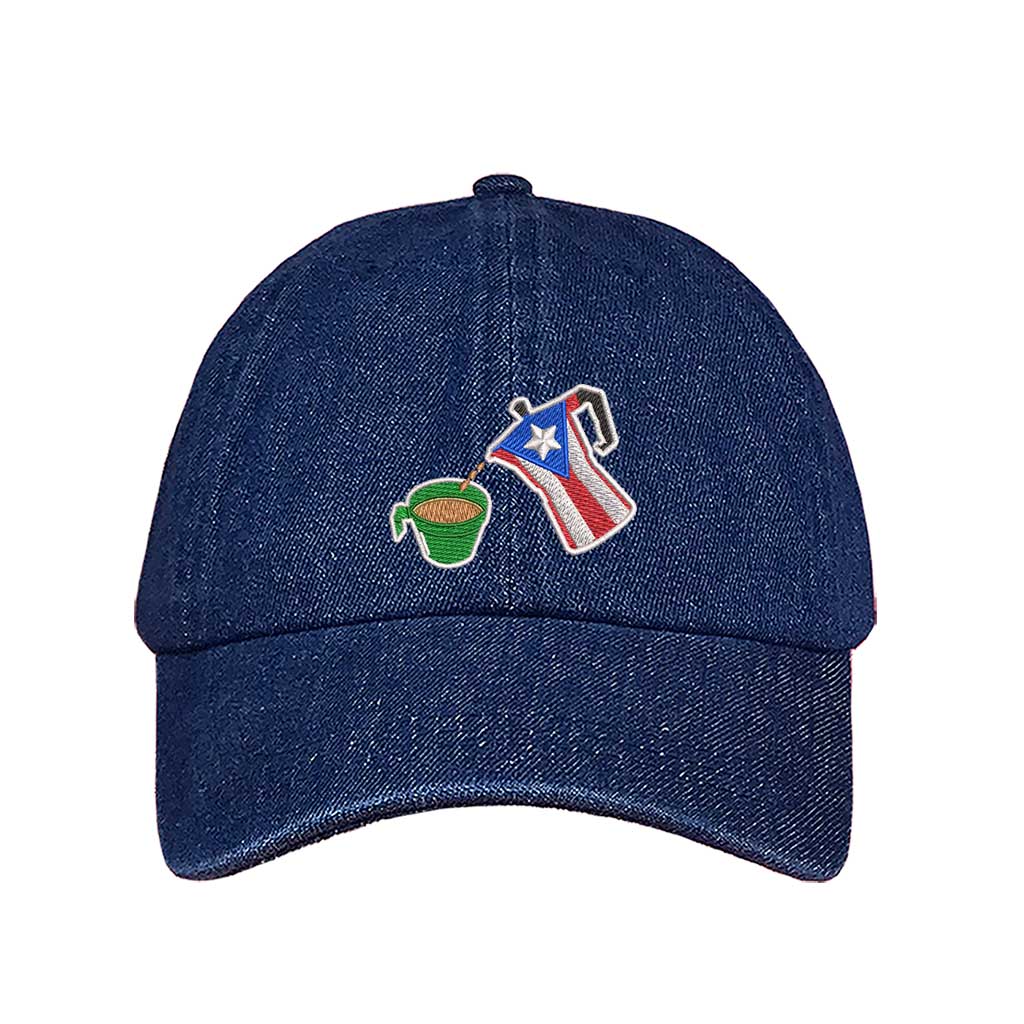 A dark denim embroidered hat featuring a detailed design of a greca (stovetop coffee maker) pouring coffee into a nostalgic green butter cup, symbolizing Puerto Rican coffee culture. The greca has the Puerto Rican flag inside it, representing heritage and tradition DSY Lifestyle