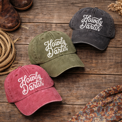 Flat lay of Red, Olive, and Black set of  DSY Lifestyle washed cotton baseball hats with "Howdy Darlin’" embroidered on the front. - DSY Lifestyle