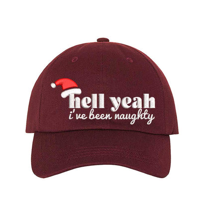 Burgundy Hell Yeah I’ve Been Naughty Embroidered Baseball Hat featuring bold statement embroidery, curved brim, and adjustable hook and loop closure – DSY Lifestyle