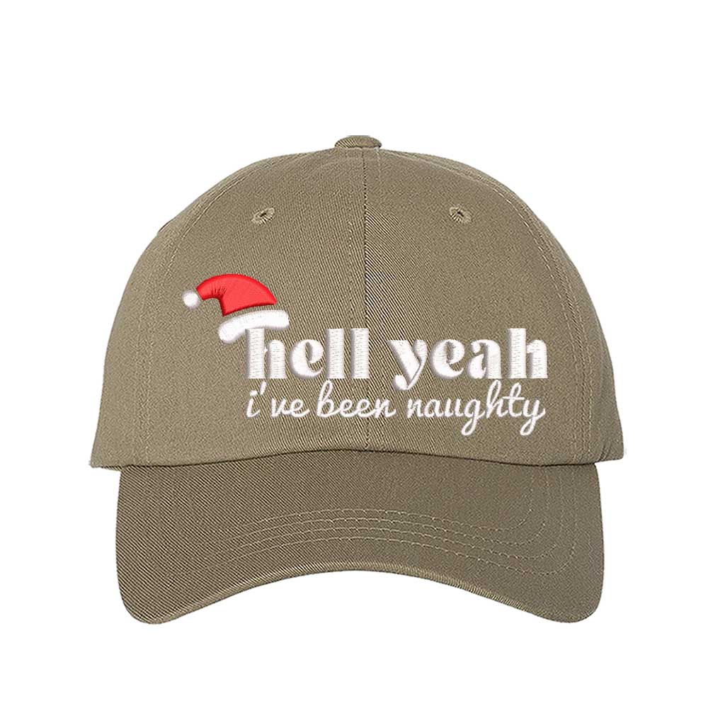 Khaki Hell Yeah I’ve Been Naughty Embroidered Baseball Hat featuring bold statement embroidery, curved brim, and adjustable hook and loop closure – DSY Lifestyle