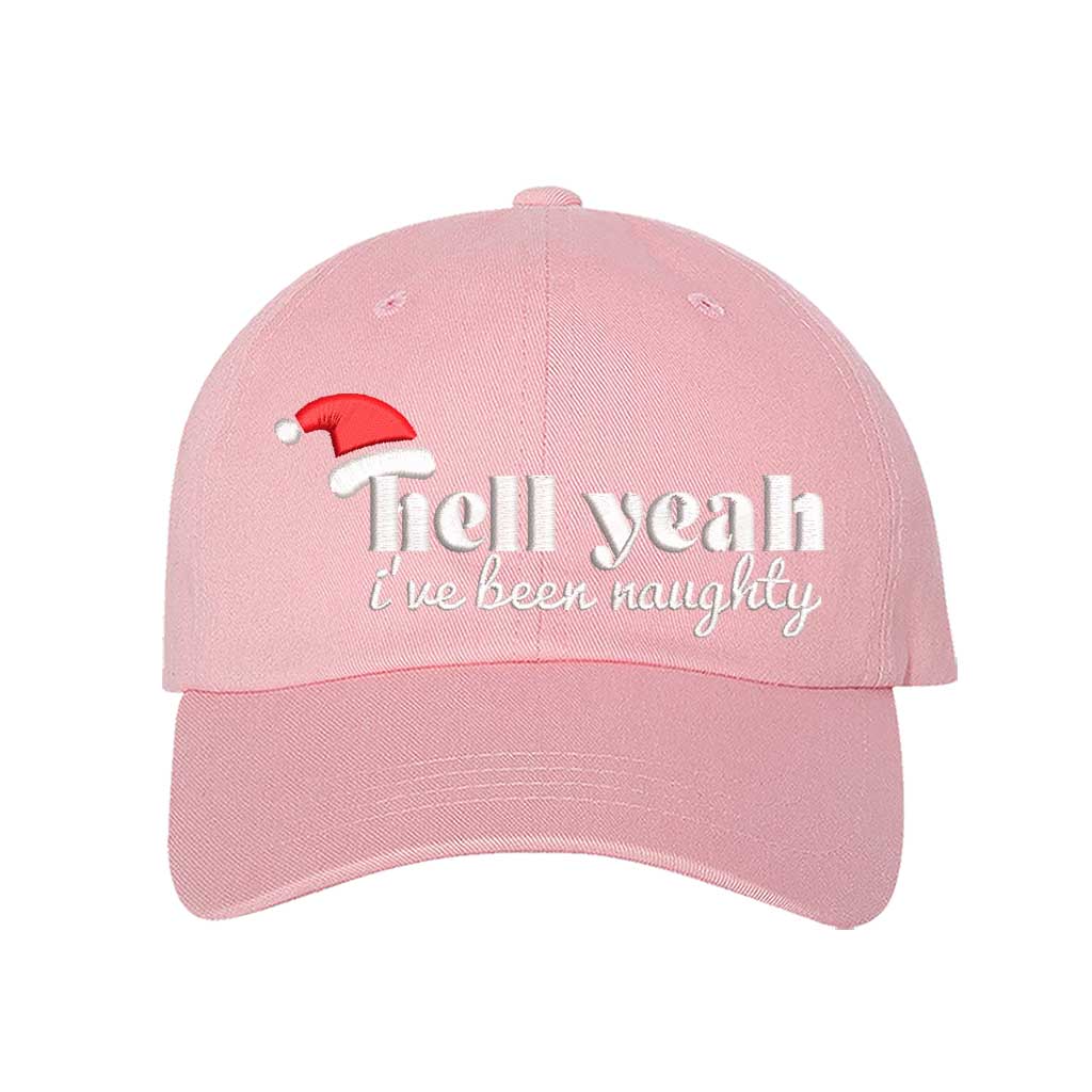Light Pink Hell Yeah I’ve Been Naughty Embroidered Baseball Hat featuring bold statement embroidery, curved brim, and adjustable hook and loop closure – DSY Lifestyle