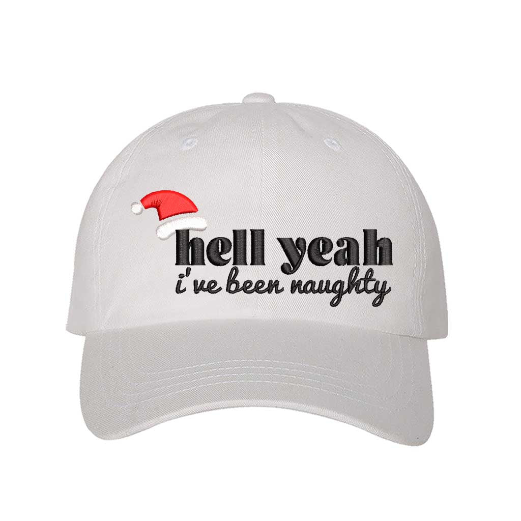 White Hell Yeah I’ve Been Naughty Embroidered Baseball Hat featuring bold statement embroidery, curved brim, and adjustable hook and loop closure – DSY Lifestyle