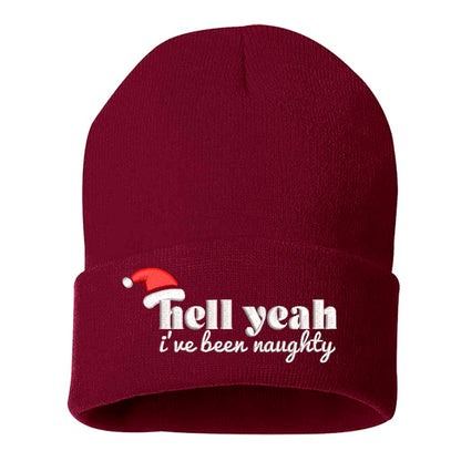 Burgundy Hell Yeah I’ve Been Naughty Embroidered Beanie Cap featuring festive red embroidery on a soft winter knit hat, perfect for Christmas humor and holiday style - DSY Lifestyle