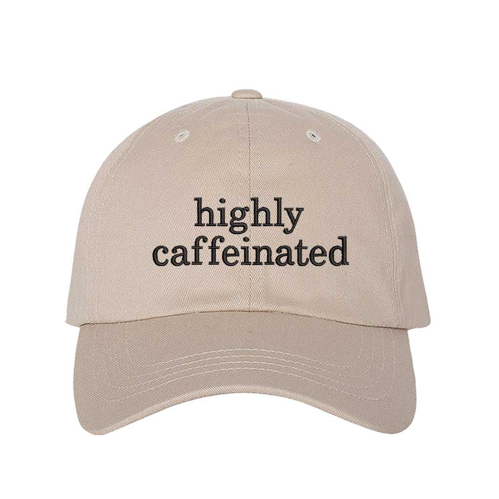 Stone cotton baseball hat featuring the phrase Highly Caffeinated in bold, crisp black embroidery. - DSY Lifestyle