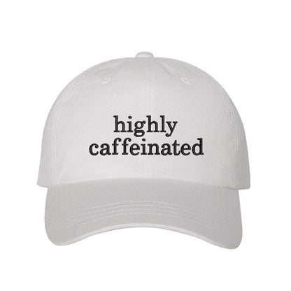 White cotton baseball hat featuring the phrase Highly Caffeinated in bold, crisp black embroidery. - DSY Lifestyle