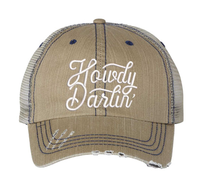 Khaki DSY Lifestyle distressed trucker hat featuring the words Howdy Darlin in bold western-style embroidery. - DSY Lifestyle