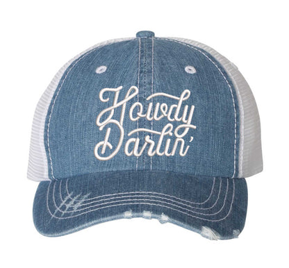Light Denim DSY Lifestyle distressed trucker hat featuring the words Howdy Darlin in bold western-style embroidery. - DSY Lifestyle