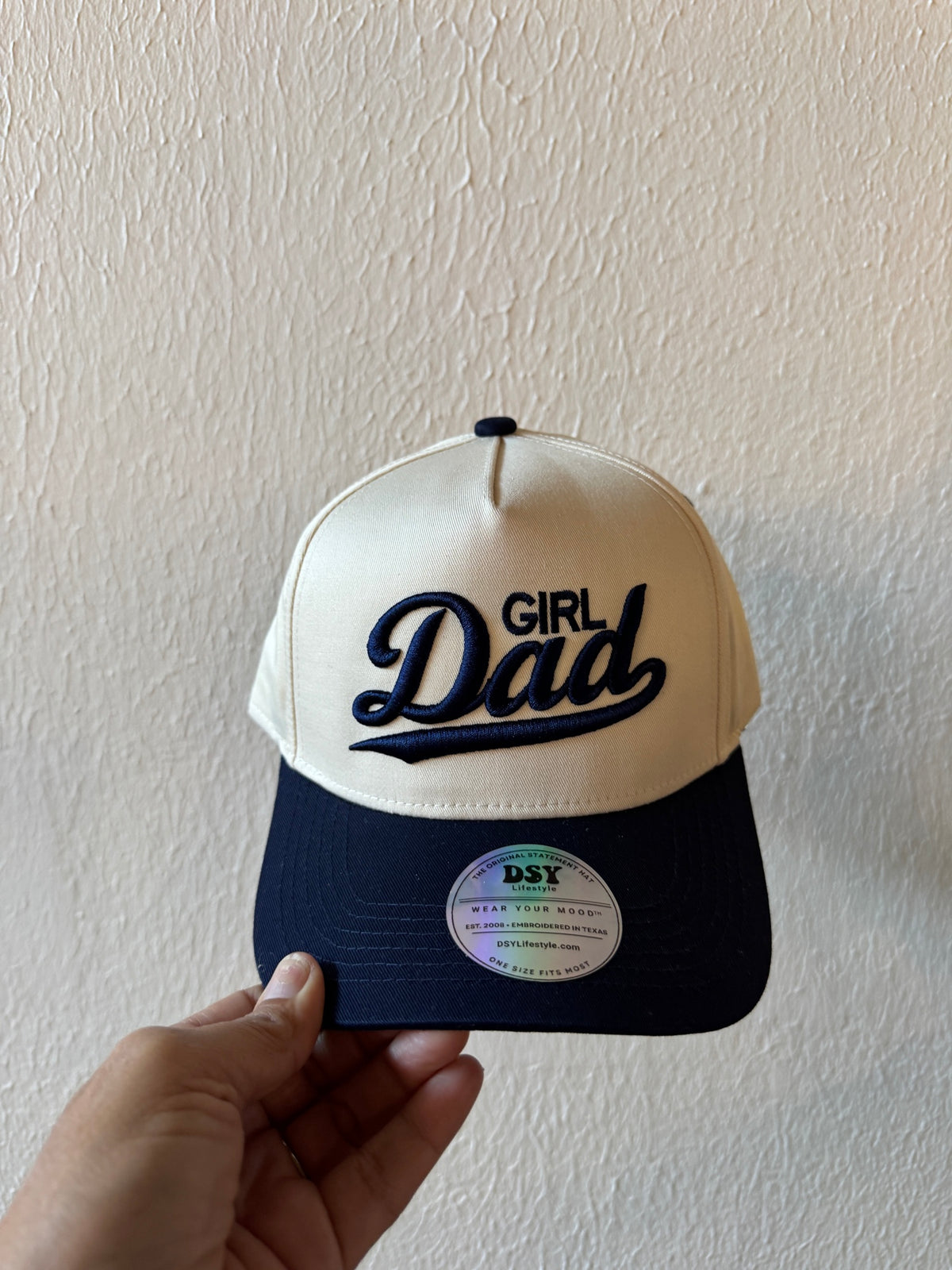 Girl Dad embroidered two-tone trucker hat on a white background