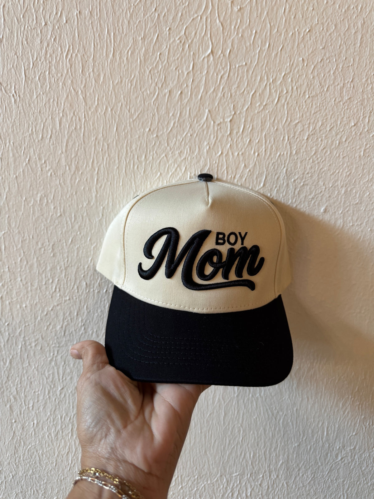 Boy Mom embroidered two-tone trucker hat on a white background