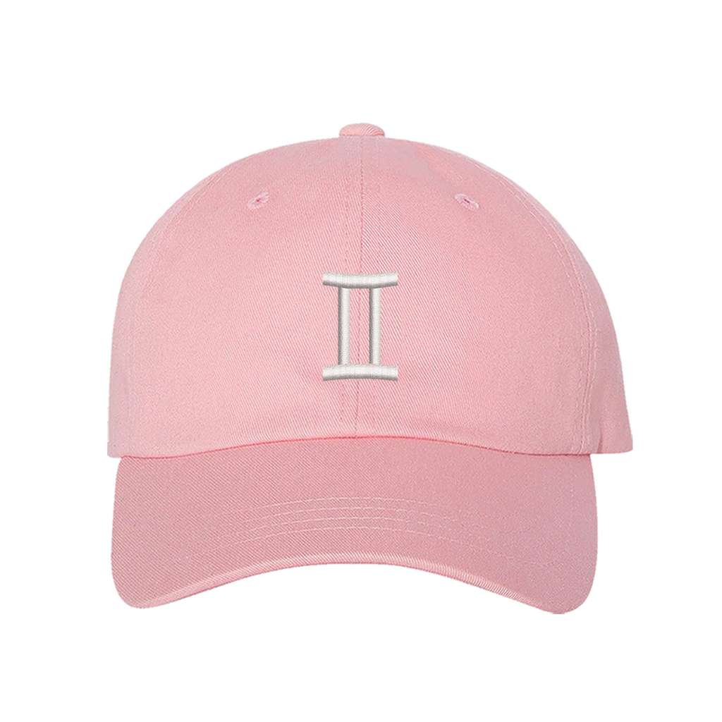 Light pink baseball hat embroidered with a gemini sign on it- DSY Lifestyle