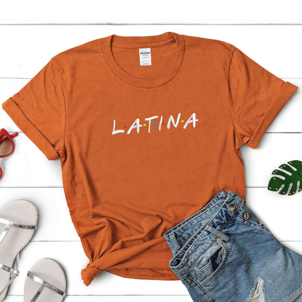 Female wearing a texas orange unisex tshirt embroidered with Latina - DSY Lifestyle