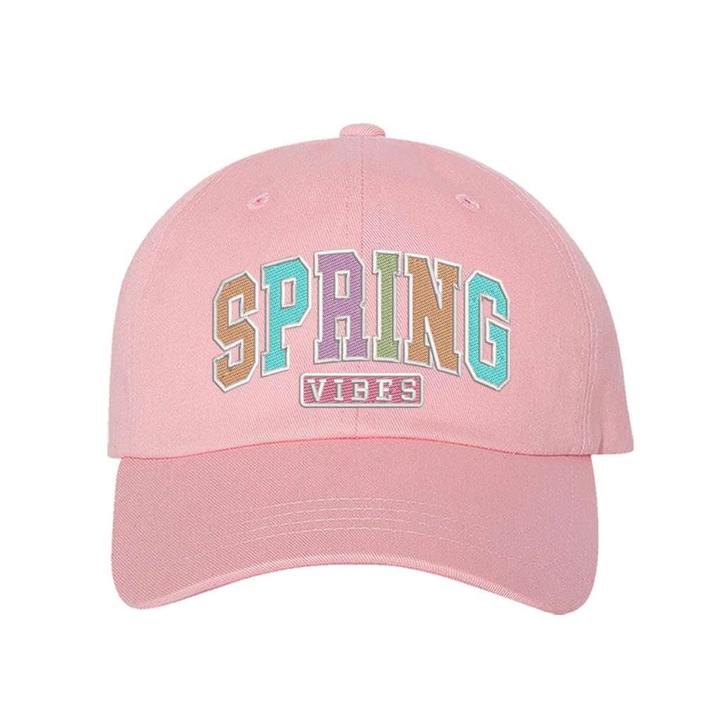 Light pink baseball hat embroidered with the phrase spring vibes on it- DSY Lifestyle