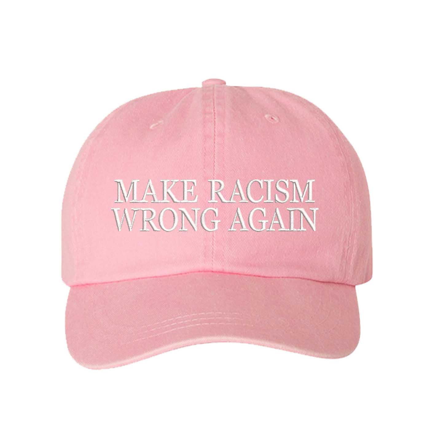 Pink DSY Lifestyle washed cotton baseball hat featuring the phrase Make Racism Wrong Again in bold, professional embroidery. - DSY Lifestyle
