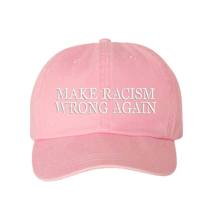 Pink DSY Lifestyle washed cotton baseball hat featuring the phrase Make Racism Wrong Again in bold, professional embroidery. - DSY Lifestyle