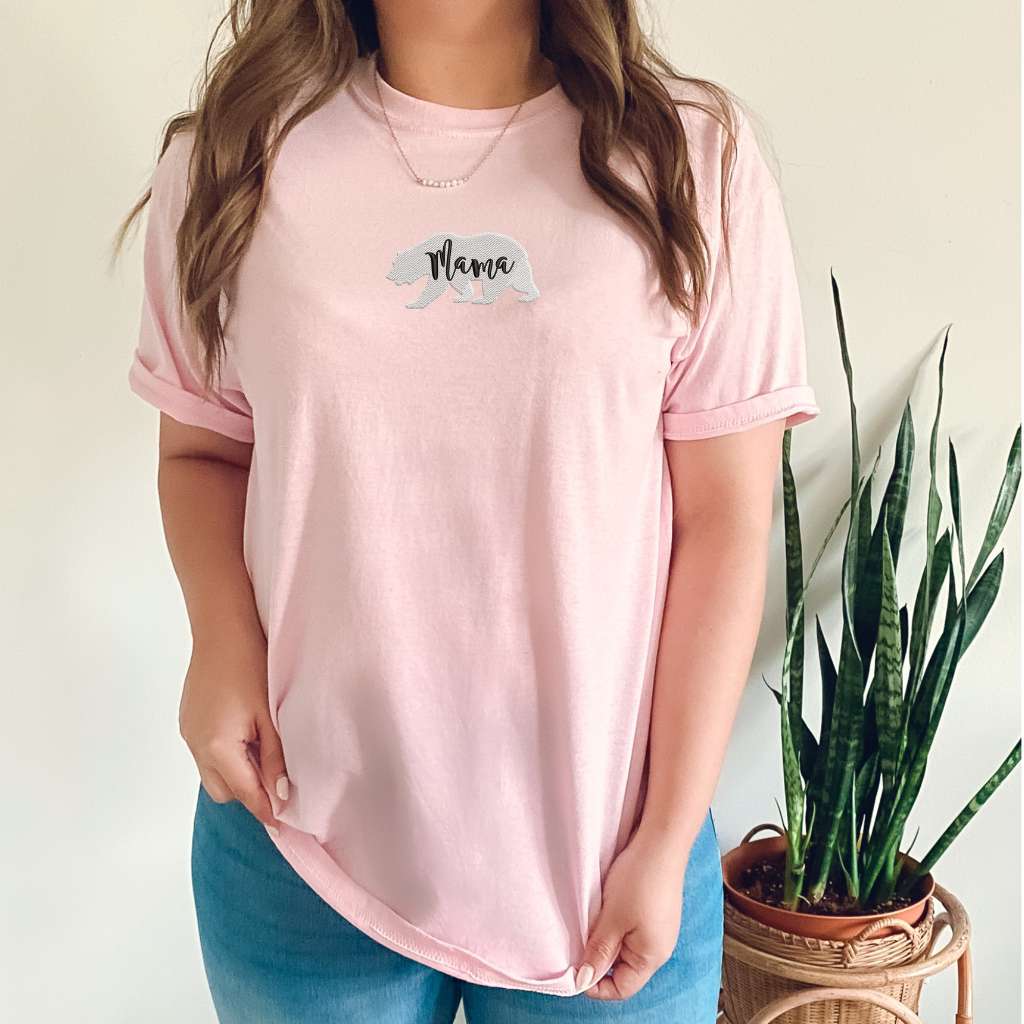 Female wearing a light pink t-shirt embroidered with a mama bear - DSY Lifestyle