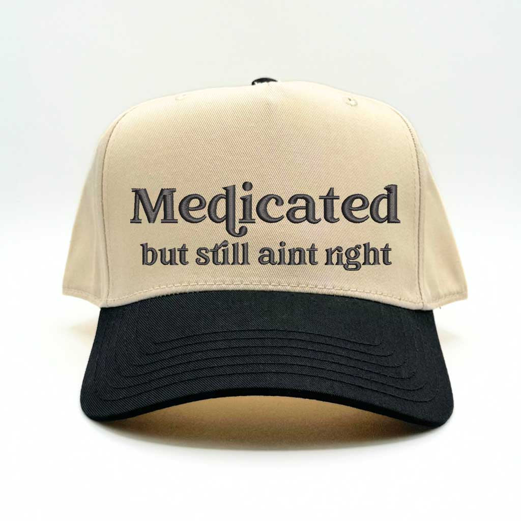 Natural with Black bill Two-tone 5-panel baseball hat with &quot;Medicated But Still Ain’t Right&quot; embroidered in bold lettering, featuring a structured fit and adjustable strap for a comfortable, stylish look - DSY Lifestyle