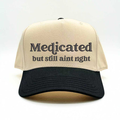 Natural with Black bill Two-tone 5-panel baseball hat with &quot;Medicated But Still Ain’t Right&quot; embroidered in bold lettering, featuring a structured fit and adjustable strap for a comfortable, stylish look - DSY Lifestyle