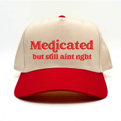 Natural with Red bill Two-tone 5-panel baseball hat with &quot;Medicated But Still Ain’t Right&quot; embroidered in bold lettering, featuring a structured fit and adjustable strap for a comfortable, stylish look - DSY Lifestyle