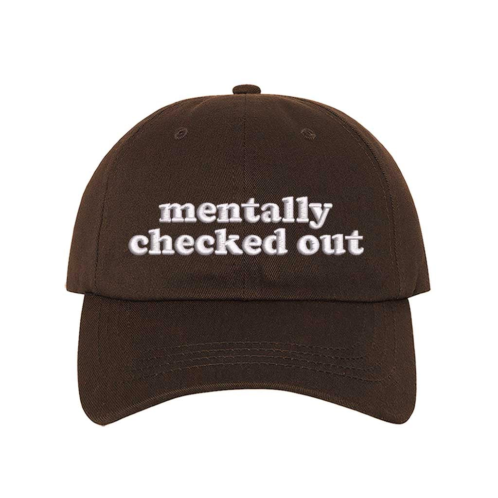 Brown cotton baseball hats with the phrase Mentally Checked Out embroidered in a clean, modern font. - DSY Lifestyle