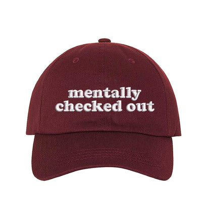 Burgundy cotton baseball hats with the phrase Mentally Checked Out embroidered in a clean, modern font. - DSY Lifestyle