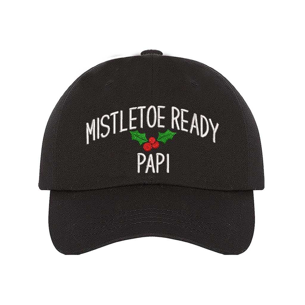 A festive black baseball hat embroidered with Mistletoe Ready Papi and mistletoe, perfect for holiday parties and Spanglish Christmas vibes. DSY Lifestyle