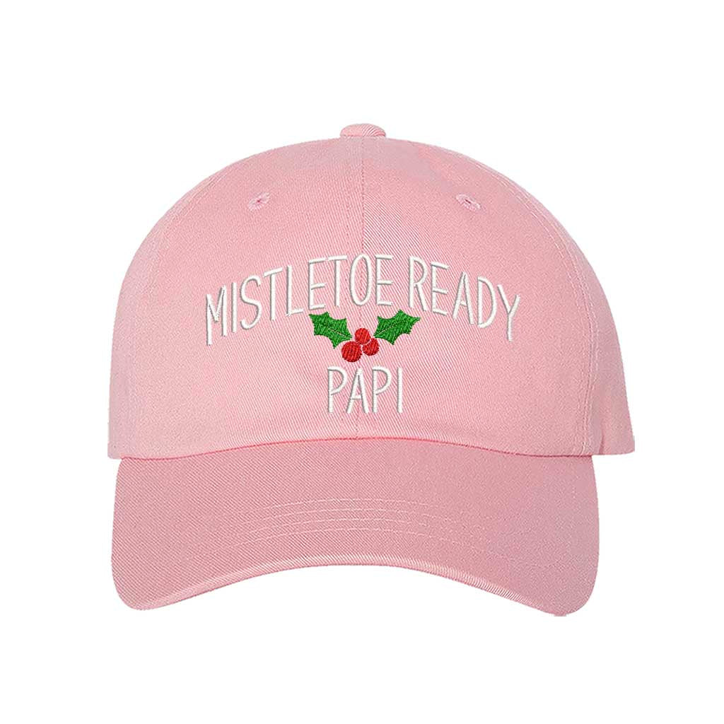 A festive Pink baseball hat embroidered with Mistletoe Ready Papi and mistletoe, perfect for holiday parties and Spanglish Christmas vibes. DSY Lifestyle