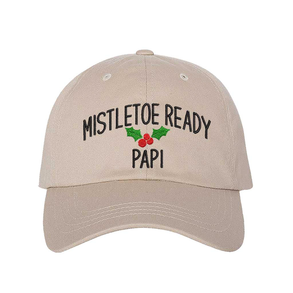 A festive Stone  baseball hat embroidered with Mistletoe Ready Papi and mistletoe, perfect for holiday parties and Spanglish Christmas vibes. DSY Lifestyle