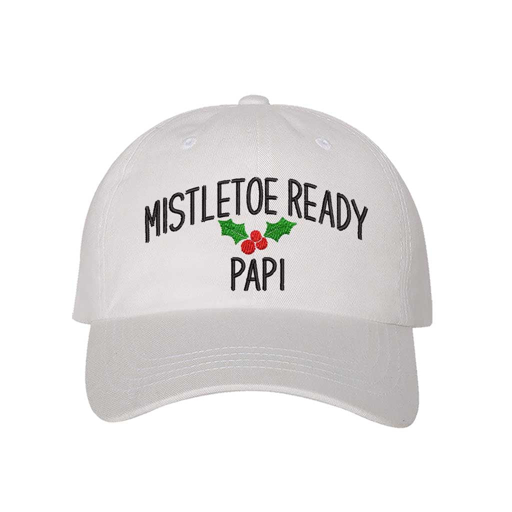 A festive White  baseball hat embroidered with Mistletoe Ready Papi and mistletoe, perfect for holiday parties and Spanglish Christmas vibes. DSY Lifestyle