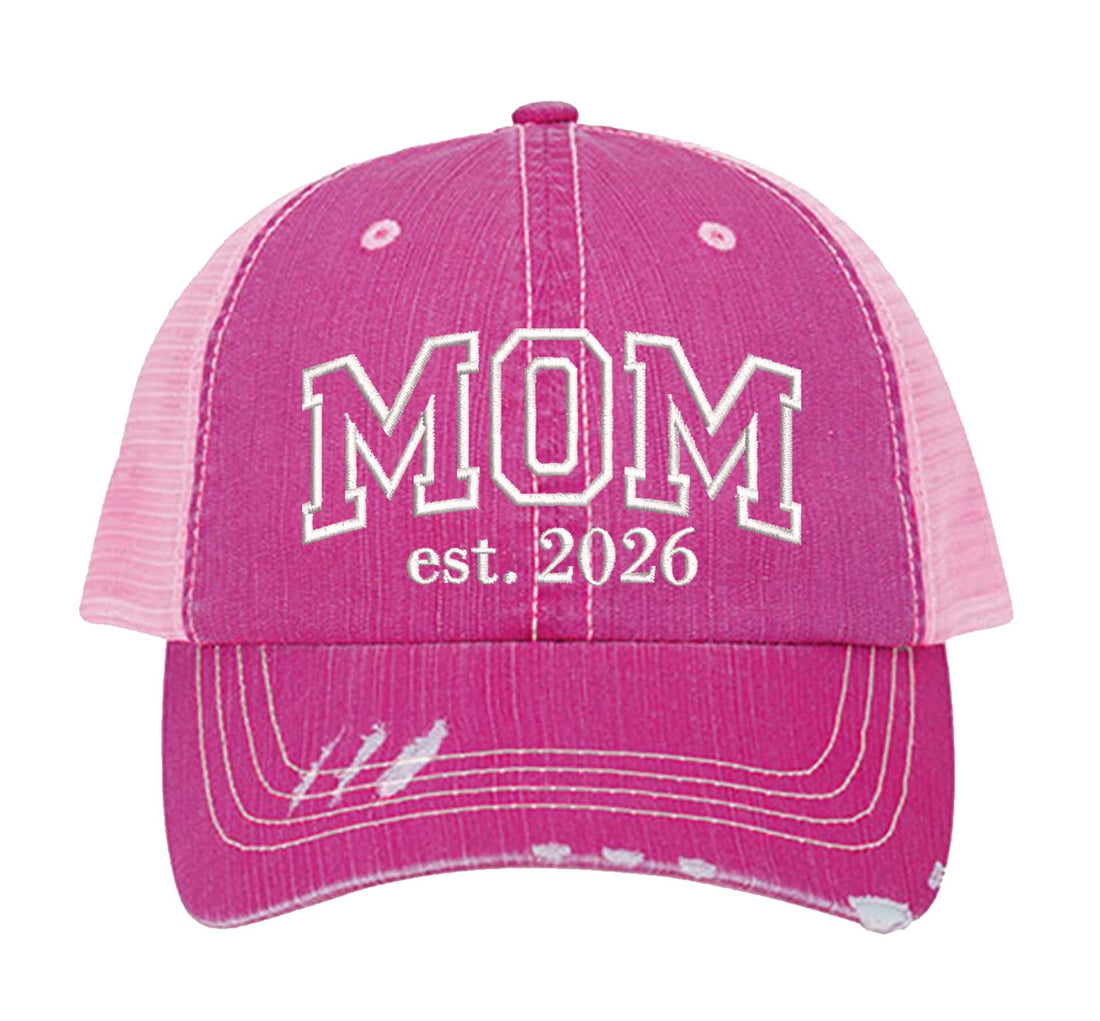 HOT Pink MOM Est. 2026 Distressed Trucker Hat. This premium vintage-style cap is the perfect gift for the unapologetically bold, featuring a breathable mesh back and custom embroidery. - DSY Lifestyle