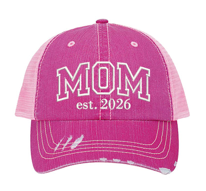 HOT Pink MOM Est. 2026 Distressed Trucker Hat. This premium vintage-style cap is the perfect gift for the unapologetically bold, featuring a breathable mesh back and custom embroidery. - DSY Lifestyle