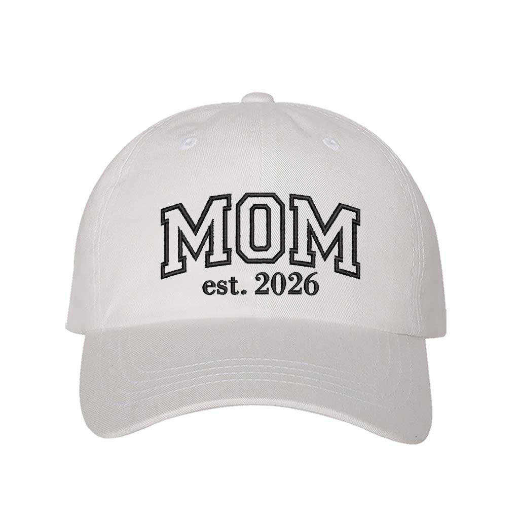 White Mom Est. 2026 Baseball Hat featuring bold white outline embroidery on a classic dad cap; the perfect 2026 baby announcement gift for new mothers by DSY Lifestyle.
