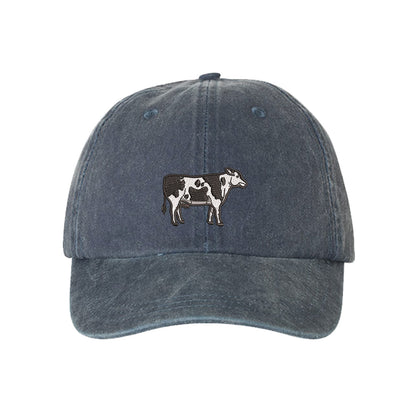 Navy Blue Holstein Cow Washed Baseball Hat featuring a detailed black and white Holstein cow embroidered on a premium washed cotton crown; a heritage-inspired farm life piece by DSY Lifestyle.