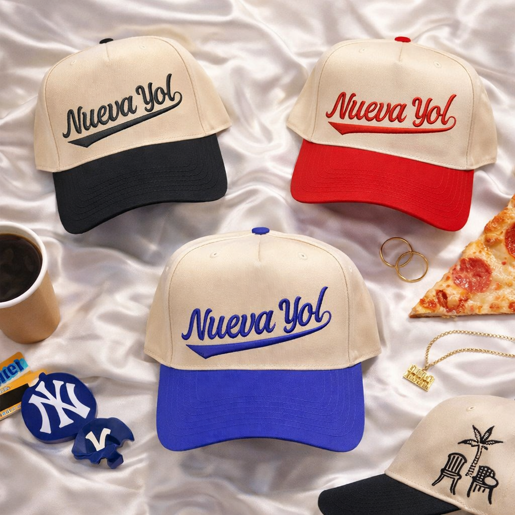 Four baseball caps with embroidered with  Nueva Yol on a white fabric background, DSY Lifestyle.