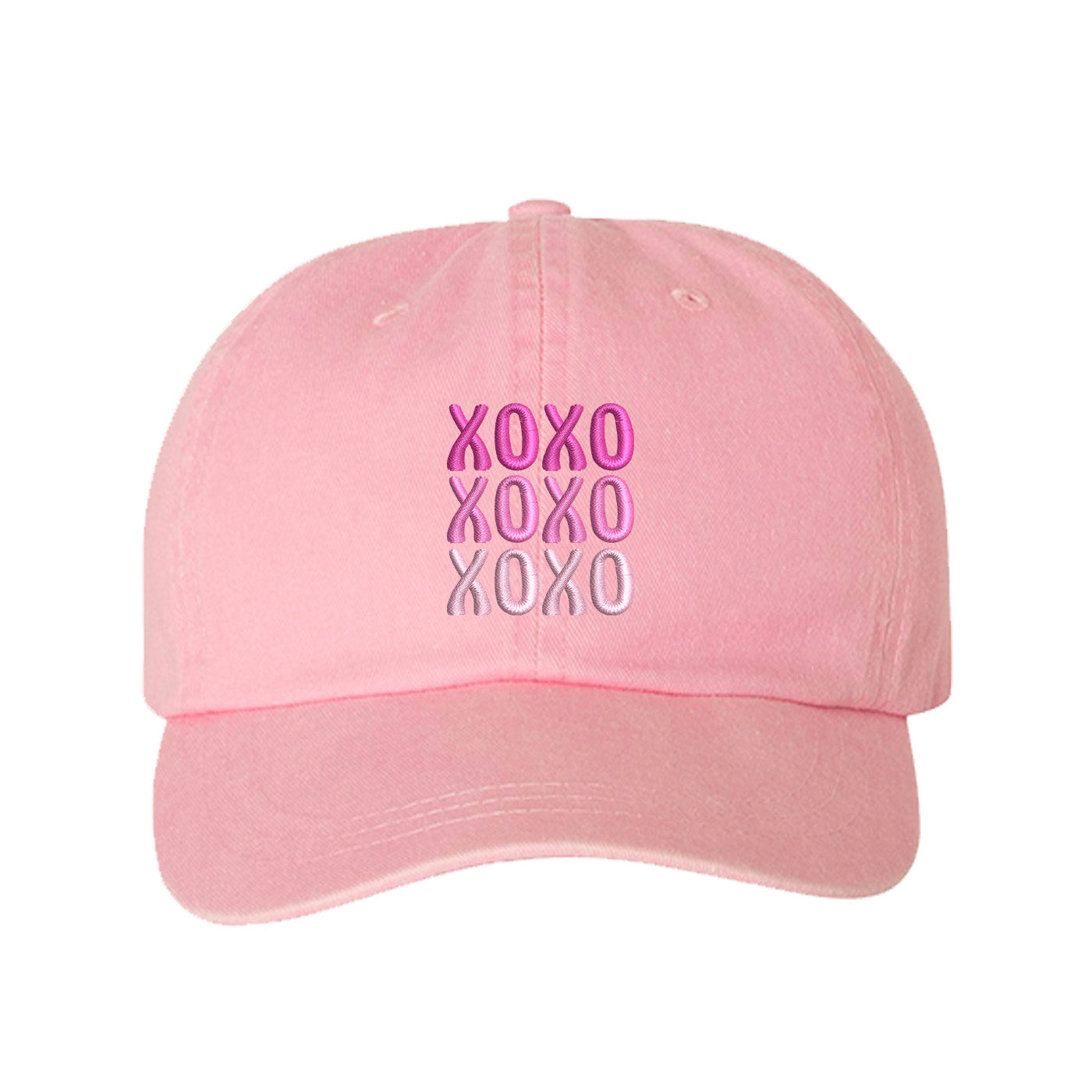 Pink XOXO Washed Baseball Hat featuring white "XOXO" embroidery on a vintage-washed charcoal dad cap by DSY Lifestyle.