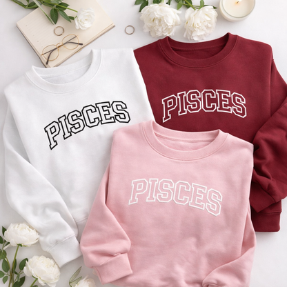 Flat lay of embroidered Pisces Sweatshirts DSY Lifestyle