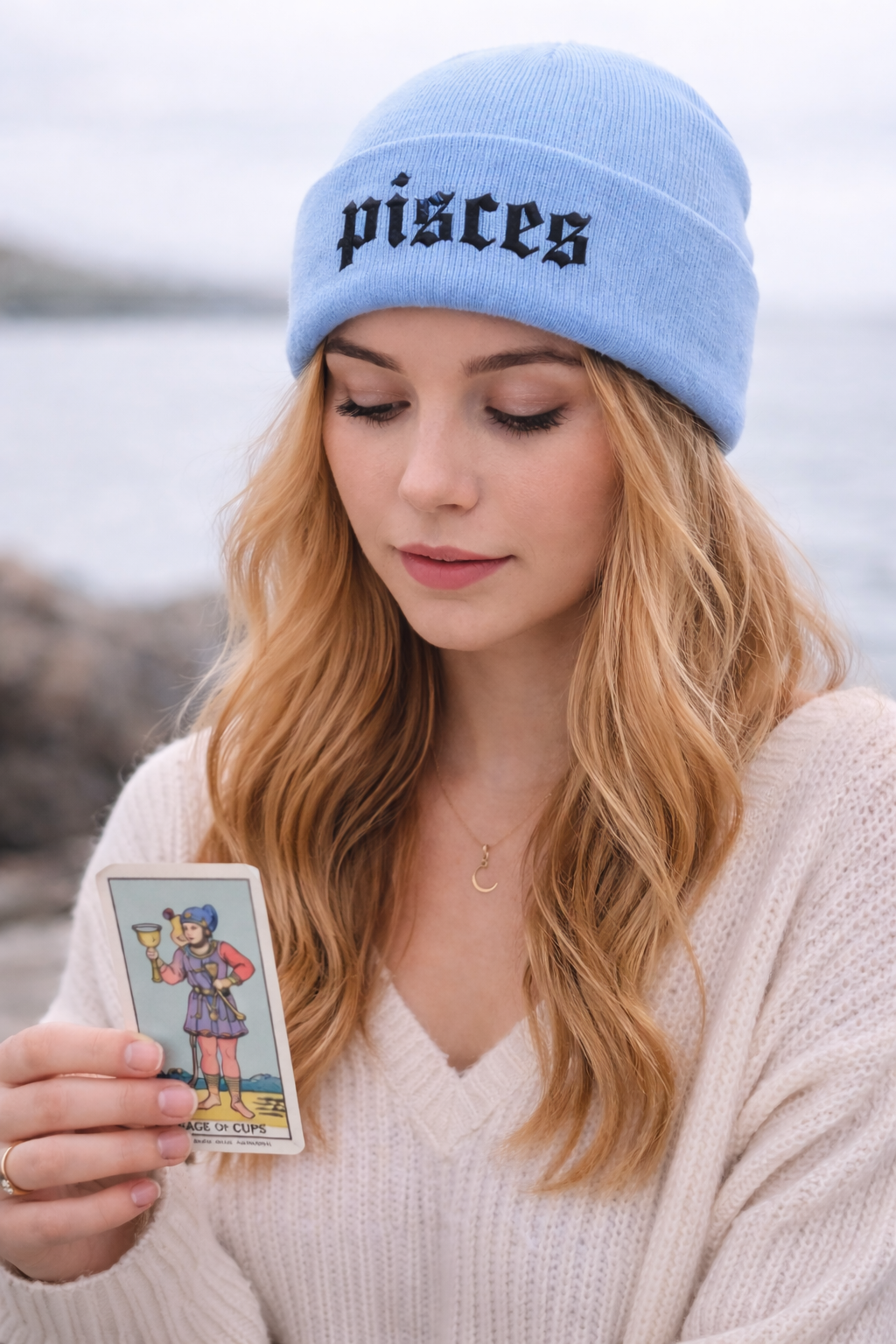Female wearing a Light Blue cuffed knit beanie featuring the Pisces zodiac symbol in high-density embroidery on the center cuff. - DSY Lifestyle