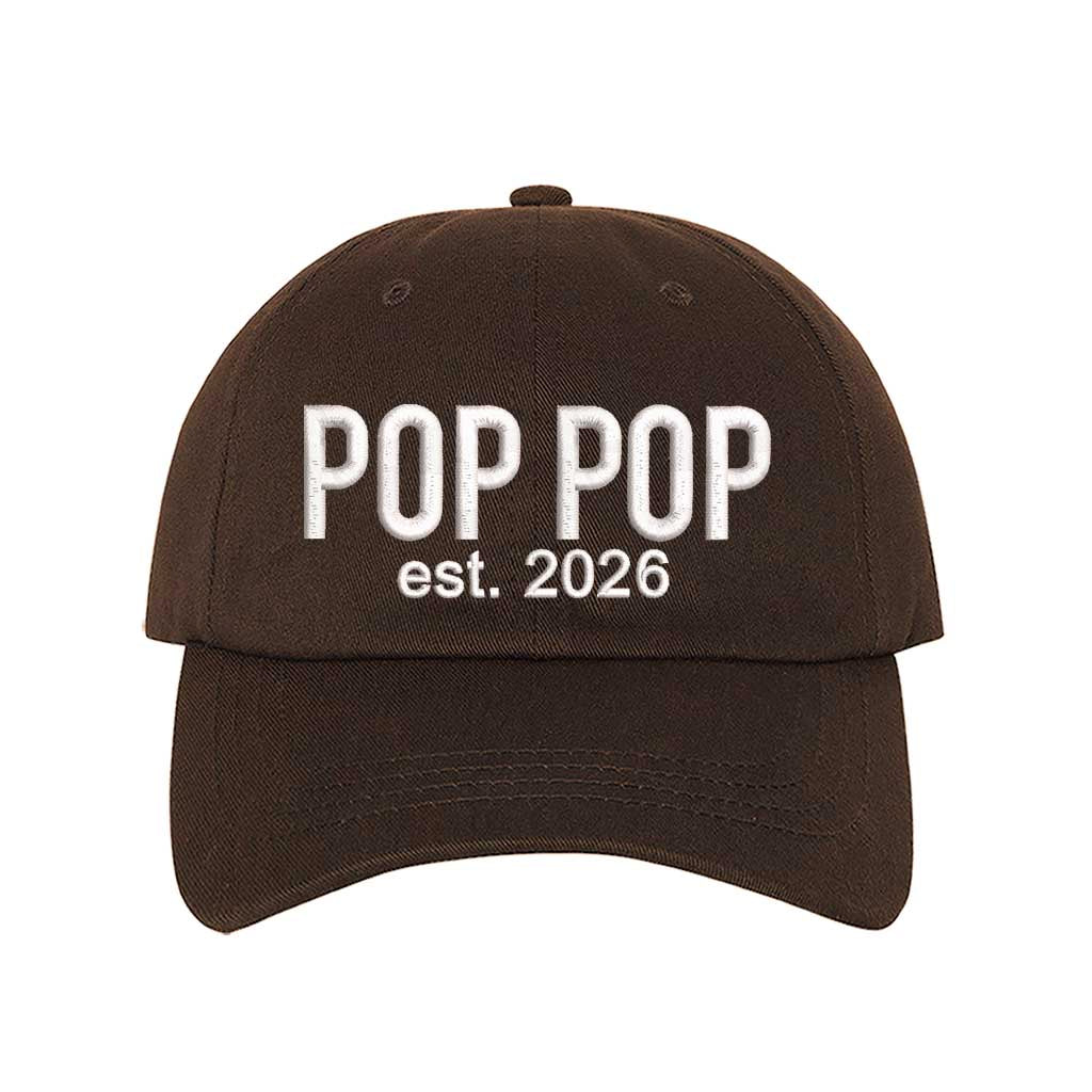Brown Pop Pop Est. 2026 Baseball Hat featuring bold white embroidery on a premium dad cap; a stylish 2026 announcement gift for new grandfathers by DSY Lifestyle.