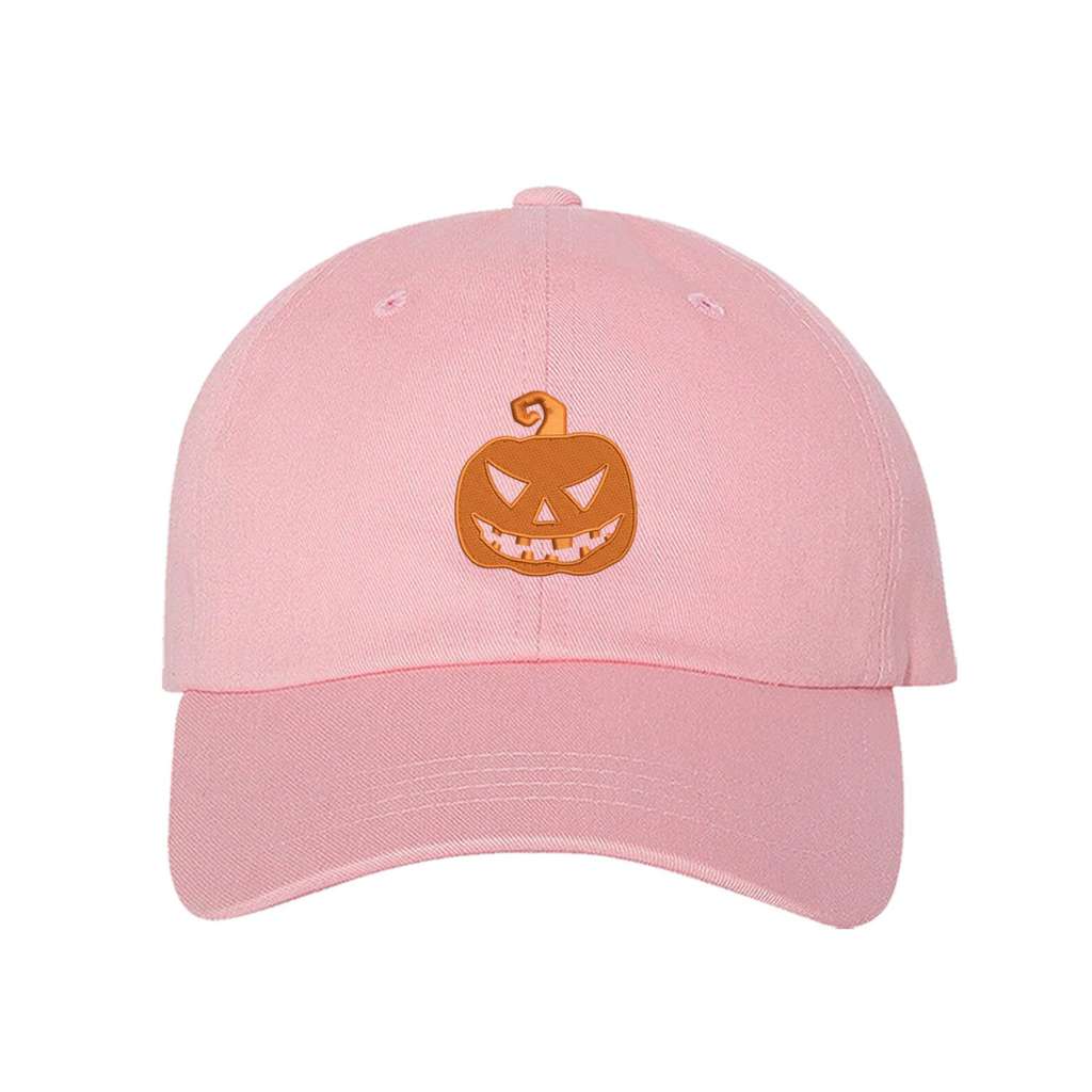 Light Pink Baseball hat embroidered with a orange jack o&