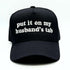 5 Panel black baseball hat embroidered with the phrase put it on my husband&