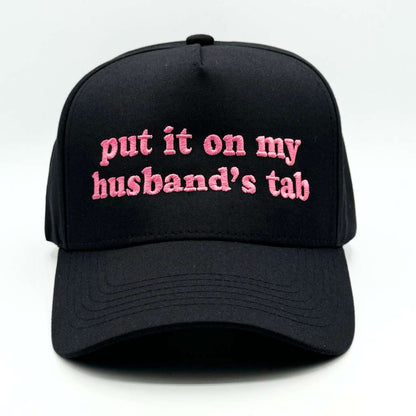 5 Panel black baseball hat embroidered with the phrase put it on my husband&