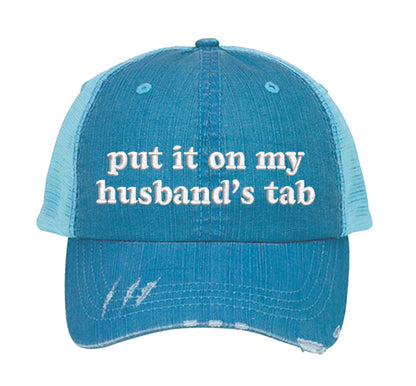 Aqua front profile view of a DSY Lifestyle distressed trucker hat featuring the words Put It On My Husband&