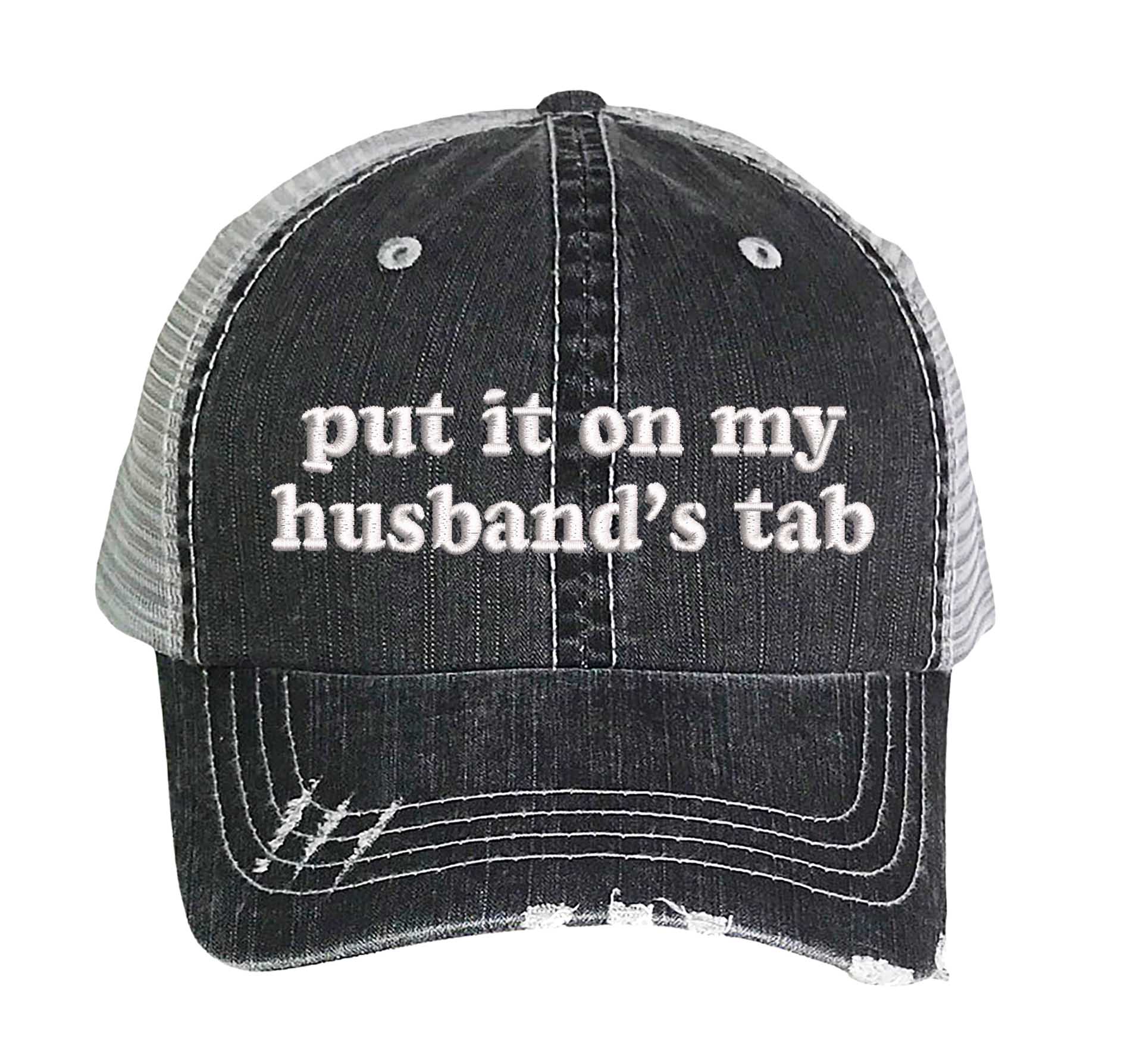 Black front profile view of a DSY Lifestyle distressed trucker hat featuring the words Put It On My Husband&